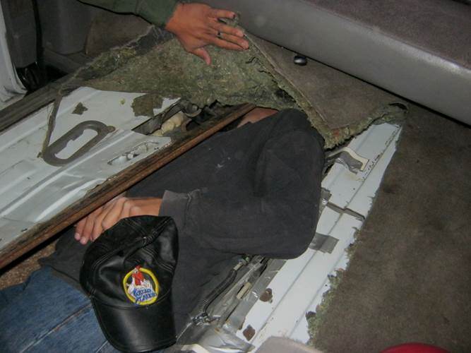 Man stuffed inside small compartment