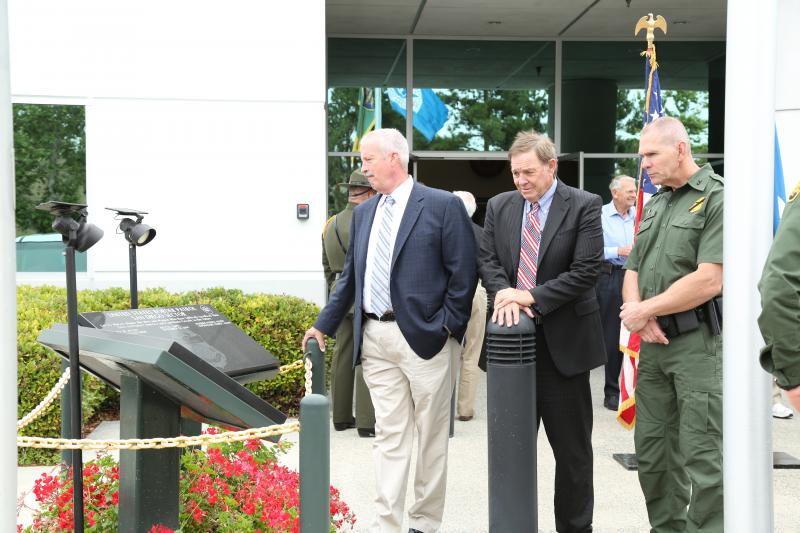 Retired Chief Patrol Agent Darryl Griffen, retired Congressman Duncan Hunter, Sr., and Chief Patrol Agent Richard Barlow view the fallen agent memorial at the USBP’s 93rd anniversary celebration on May 25, 2017.