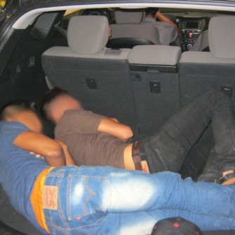 Two illegal aliens were hiding in the SUV’s cargo area, three others were sitting in the rear seat.