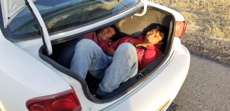 Agents stopped a vehicle, which turned out to be carrying two people in the trunk