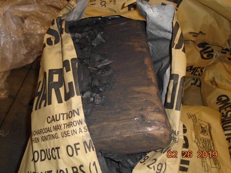 A CBP canine alerted officers to bundles of marijuana within a shipment of charcoal