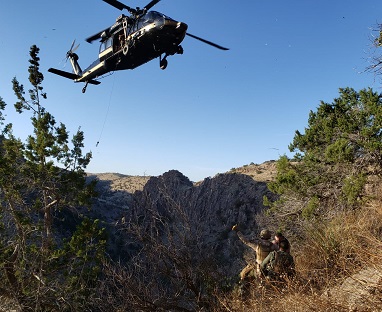 An injured agent had to be rescued from a mountain top by a National Guard helicopter