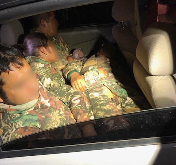 Agents discovered five persons in the backseat of a smuggling vehicle