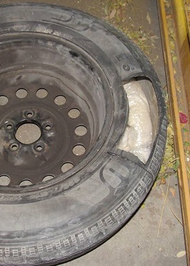 Officers discovered packages of meth within the spare tire of a smuggling vehicle