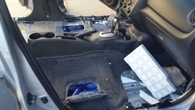 Packages of meth and fentanyl were discovered beneath the seats of a smuggling vehicle