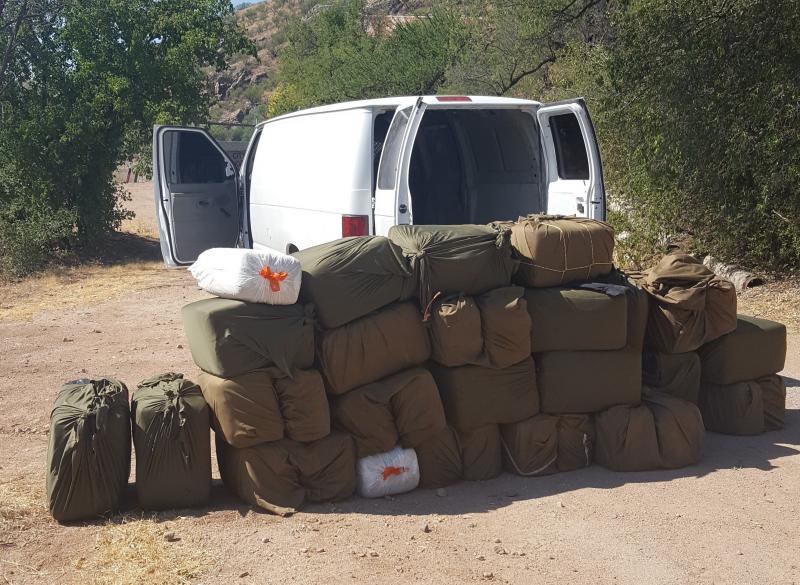 Agents discovered more than 1,000 pounds of marijuana inside of a cargo van after the driver and passenger attempted to flee on foot