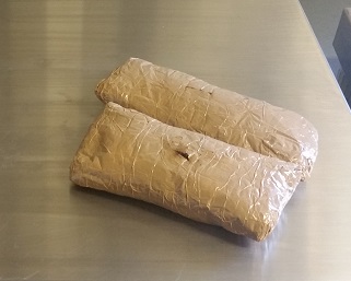 Officers discovered more than 3 pounds of heroin wrapped around the subjects' chest