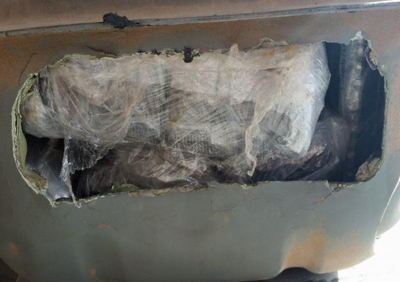 When officers removed the fuel tank of a smuggling vehicle, they discovered packages of cocaine and heroin inside.