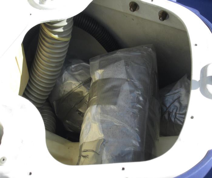 CBP officers discovered packages of marijuana underneath the seat of a watercraft.