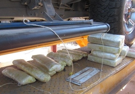 Officers removed cocaine, meth and heroin from the rocker panels of a smuggling vehicle