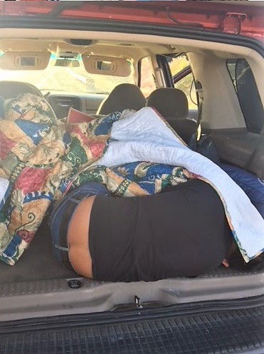 Agents discovered 2 illegal aliens beneath blankets in the back of a smuggling vehicle 