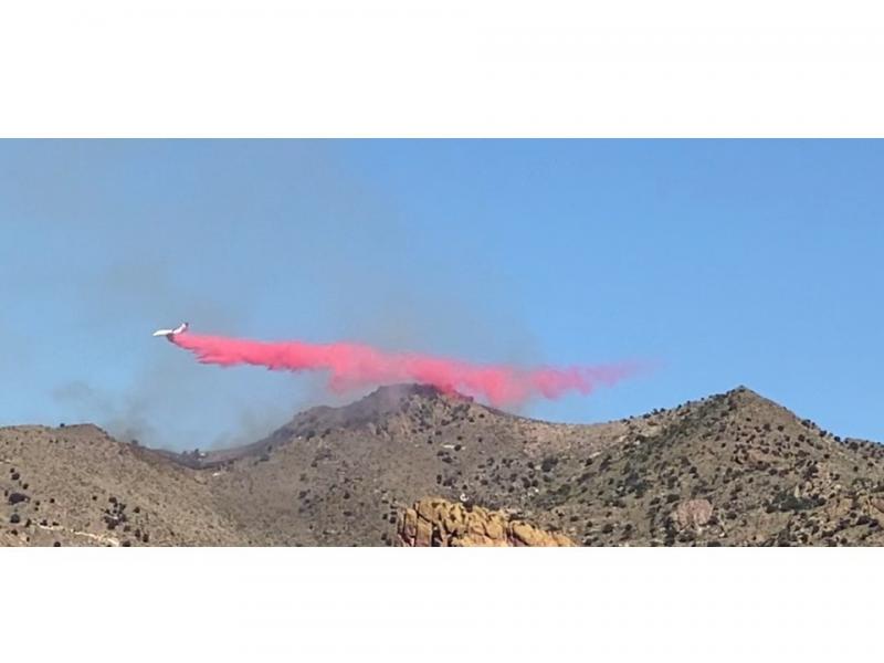Aircraft dropping Slurry nearby in an effort to stop the progress of a forest fire