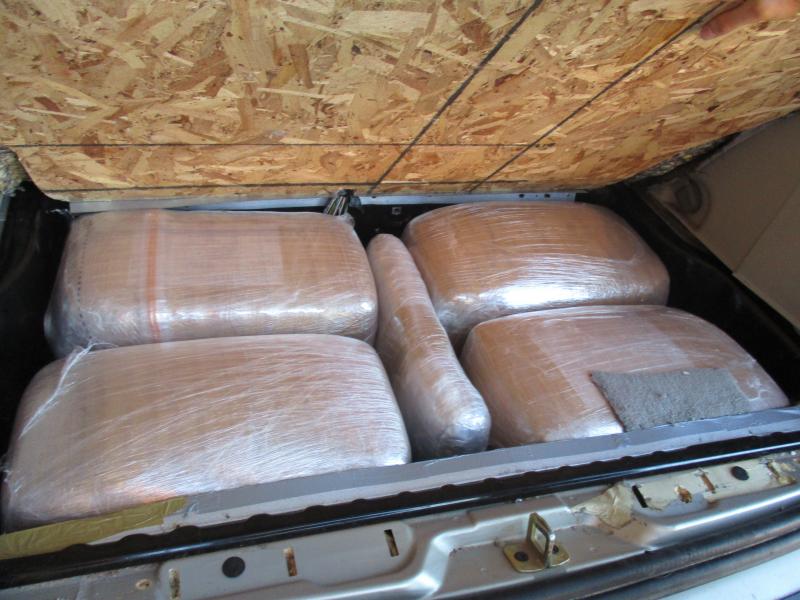 Officers at the Port of Lukeville discovered packages of marijuana within the back of a smuggling vehicle