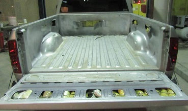 Officers removed a combination of meth, heroin and fentanyl from beneath a bedliner removed from a Dodge truck 