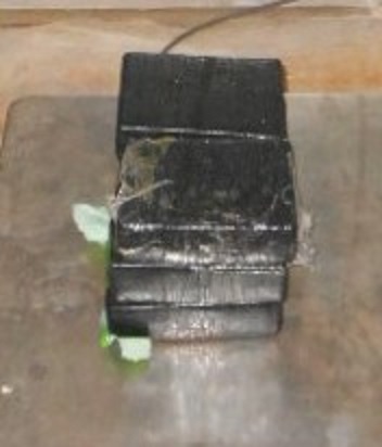 Bundles containing 12.61 pounds of heroin seized by CBP officers at Pharr International Bridge