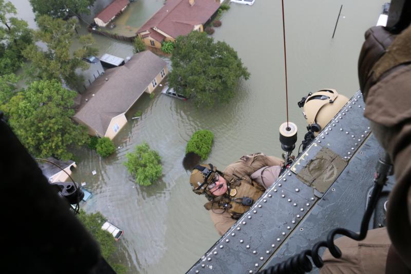 CBP Air and Marine agents prepared to descend to rescue disaster survivors during search and rescue missions in support of Hurricane Harvey response.