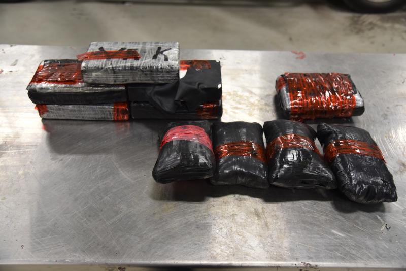 Packages containing 10.84 pounds of black tar heroin, 2.73 pounds of brown heroin and 12.38 pounds of cocaine seized by CBP officers at Juarez-Lincoln Bridge