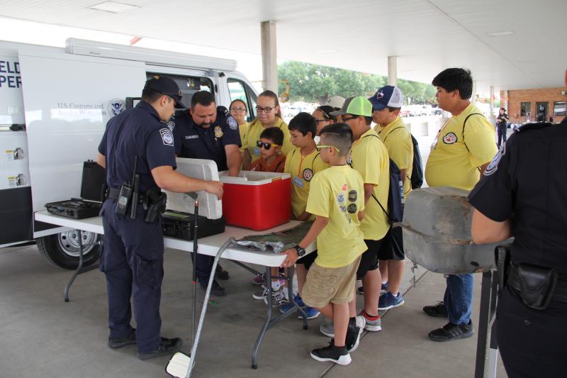 Children of CBP employees observe different items used to conceal narcotics during Eagle Pass Port of Entry's annual Bring Your Child to Work Day