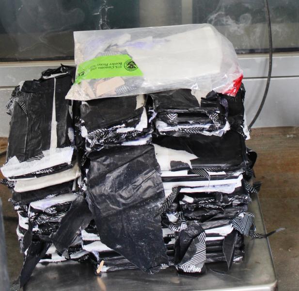 Packages containing 54 pounds of heroin seized by CBP officers at Pharr International Bridge.