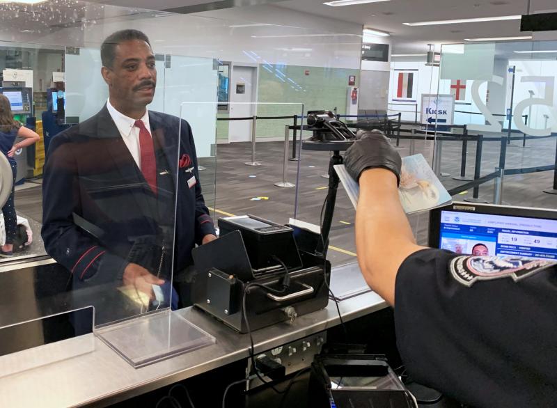 A traveler processes his admission using CBP's Simplified Arrival biometric comparison technology at Philadelphia International Airport 