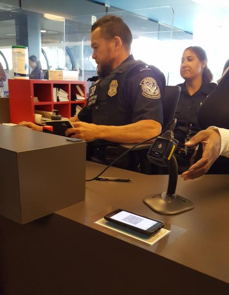 CBP officer processes a traveler's return to the U.S. using the newly launched Mobile Passport Control at Pittsburgh International Airport June 14, 2018.