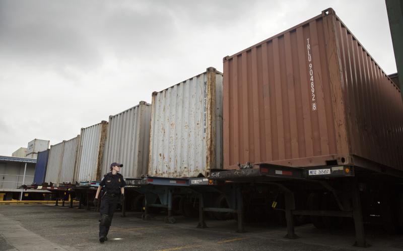 A CBP officer inspects cargo at a port of entry.