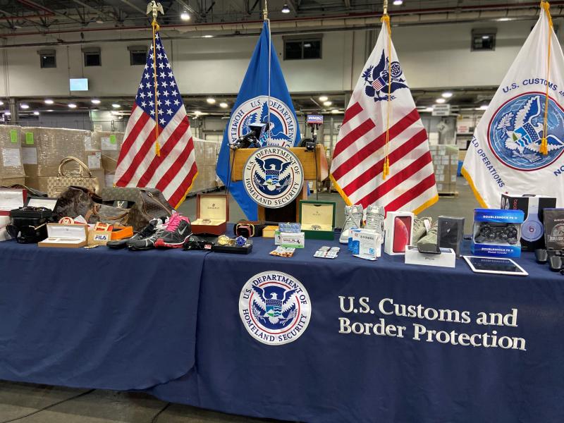 Counterfeit goods seized by CBP and on display at JFK during the media event.