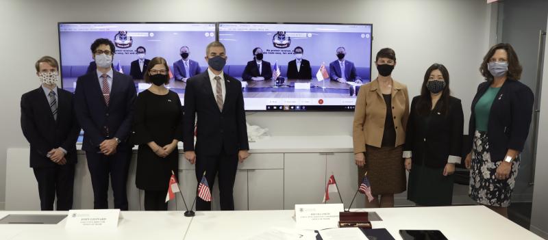 The U.S. and Singaporean negotiating teams pose for a photo after the virtual signing ceremony.