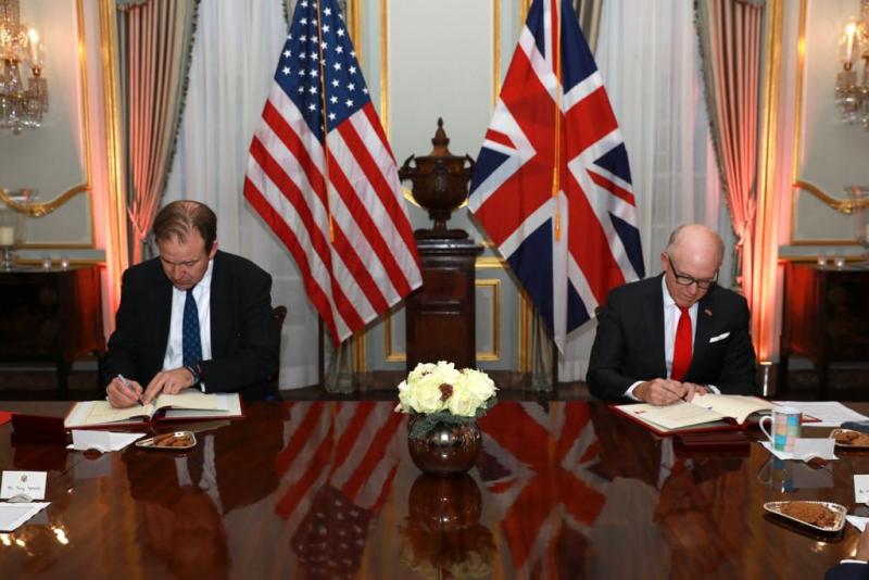 US Ambassador Robert Wood Johnson and the Rt. Hon. Jesse Norman conclude the US-UK CMAA Agreement in London.