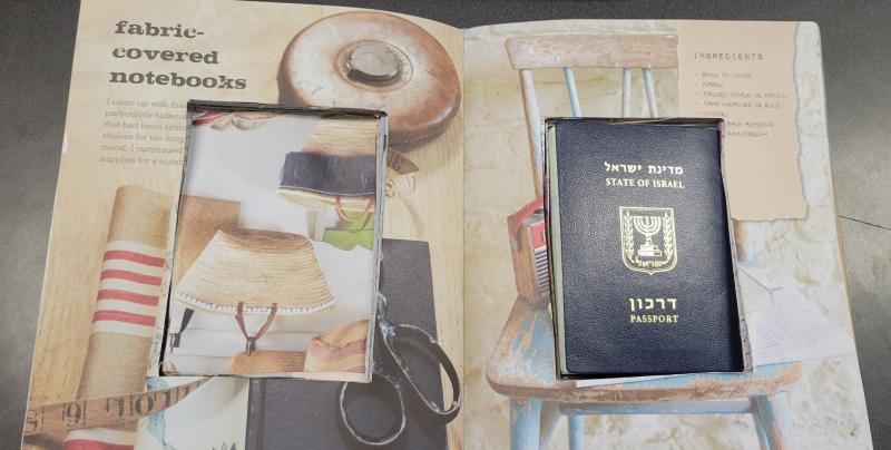 Hollowed out book with Israeli passport inside. 