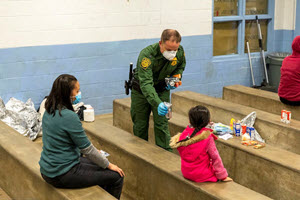 Border Patrol agents at Brown Field Station near San Diego use personal protective equipment and social distancing to protect themselves and the people they encounter from the coronavirus.